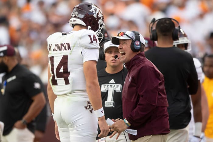 Texas A&M quarterback Max Johnson (14) is yelled to by Texas A&M head coach Jimbo Fisher during a football game between Tennessee and Texas A&M at Neyland Stadium in Knoxville, Tenn., on Saturday.